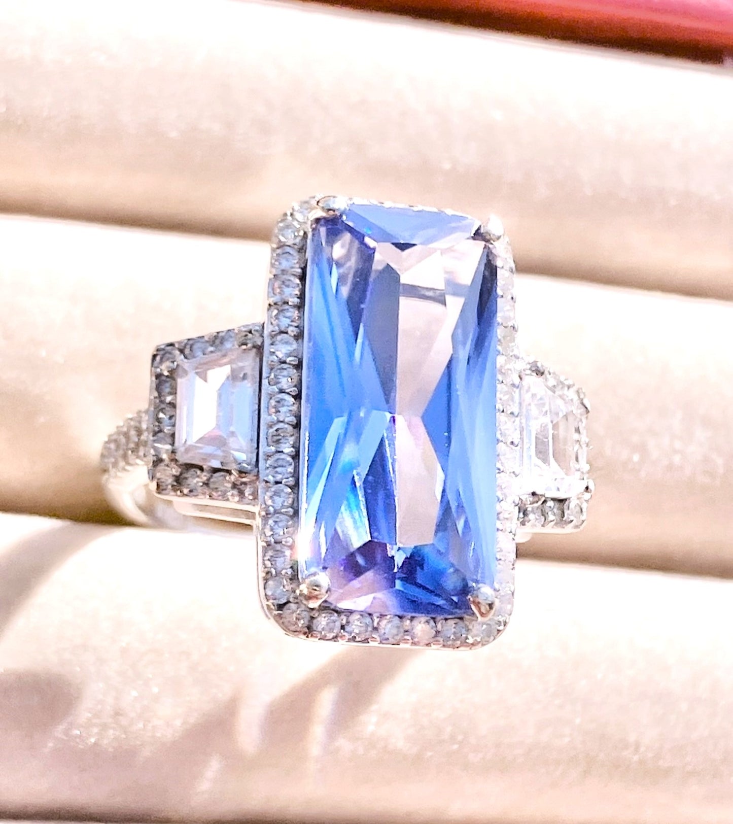 Periwinkle “Sapphire” in “Diamond” Halo with Trapezoid Cut “Diamond” Accents