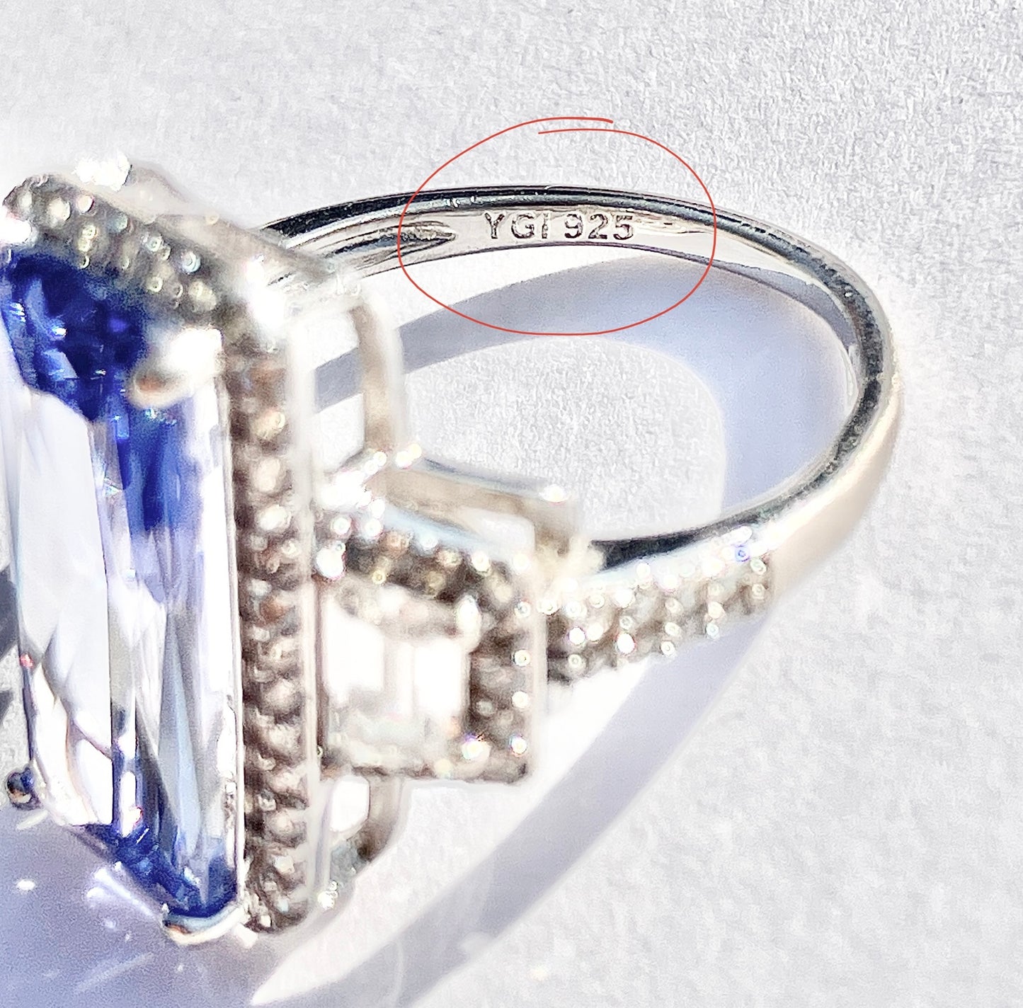 Periwinkle “Sapphire” in “Diamond” Halo with Trapezoid Cut “Diamond” Accents