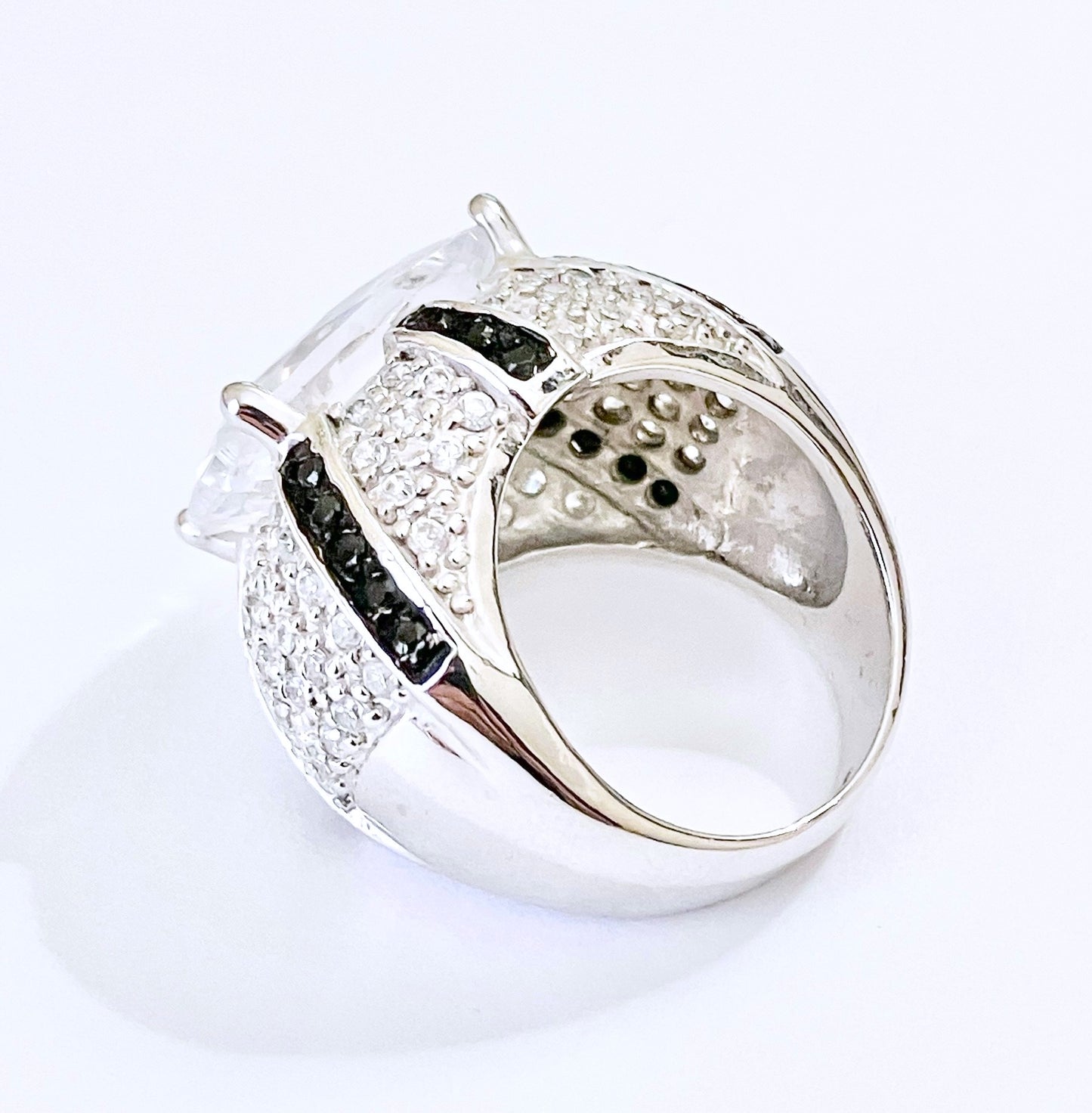 Oval Cut “Diamond” in Black and Colorless “Diamond” Dome Setting Ring