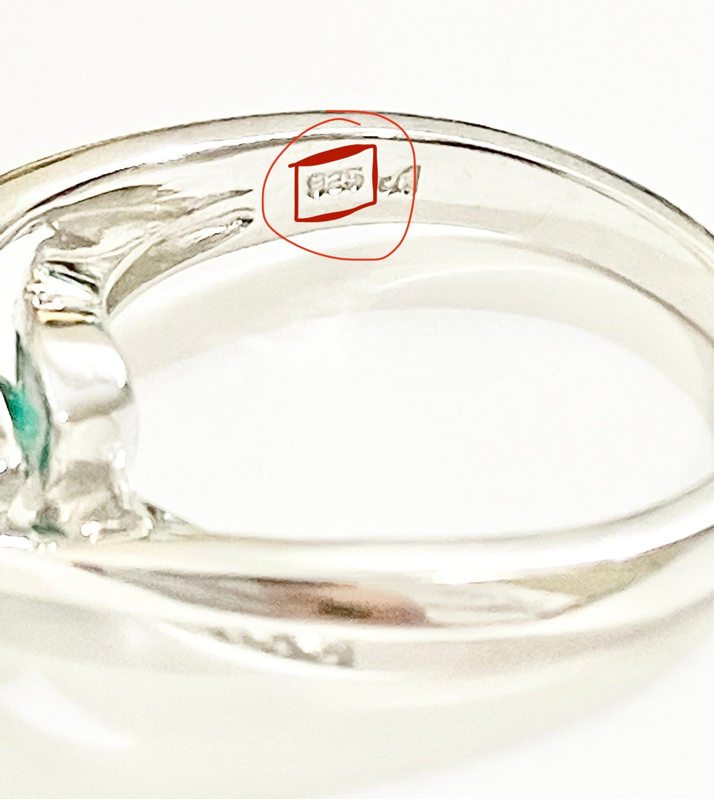 Triangular Brilliant Cut “Emerald” in Curved Bypass Shank with “Diamond” Accents Ring