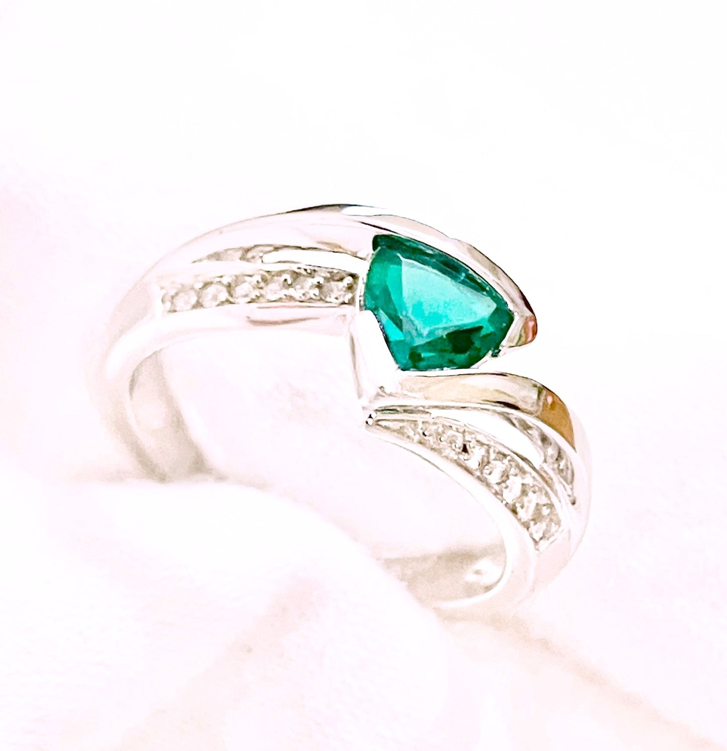 Triangular Brilliant Cut “Emerald” in Curved Bypass Shank with “Diamond” Accents Ring