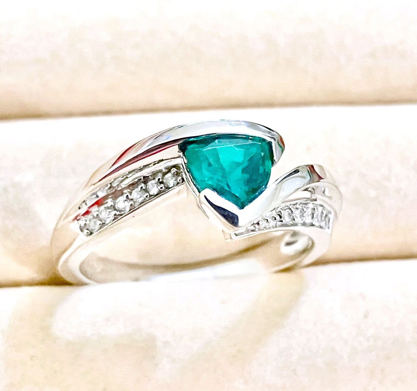 Triangular Brilliant Cut “Emerald” in Curved Bypass Shank with “Diamond” Accents Ring