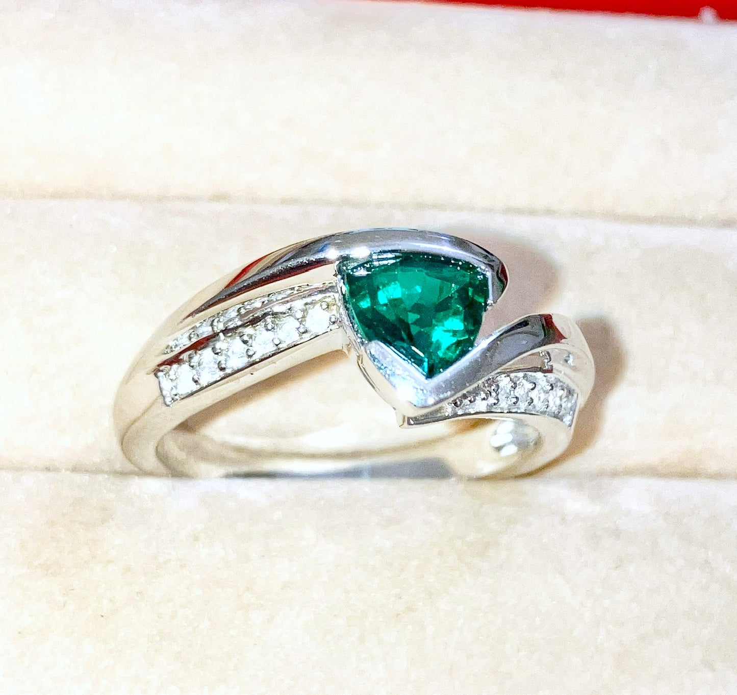 Triangular Brilliant Cut “Emerald” in Curved Bypass Shank with “Diamond” Accents Ring