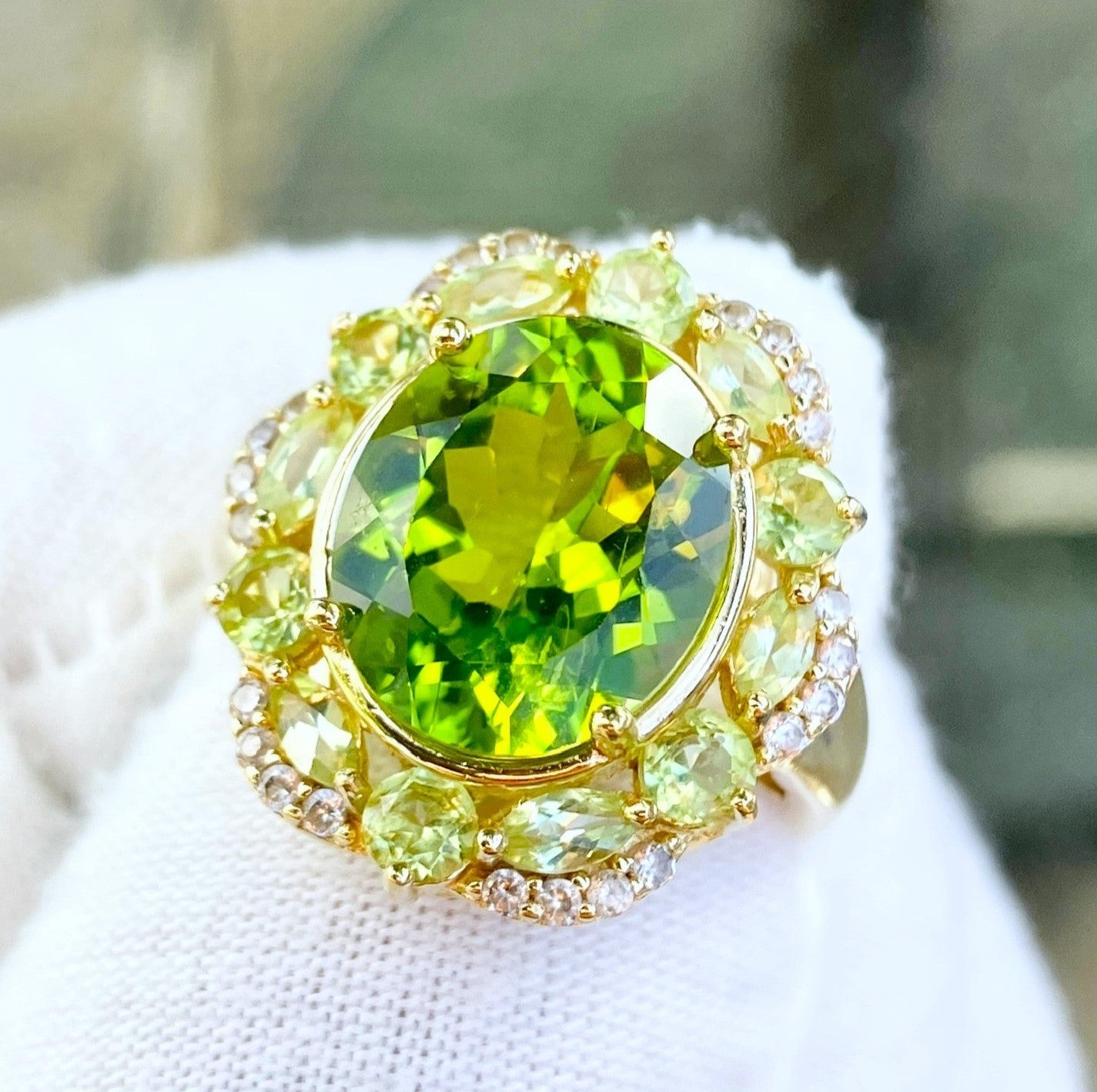 Gold Plated Oval Peridot in a Marquise and Round Cut Peridot Halo with “Diamond” Accents Ring