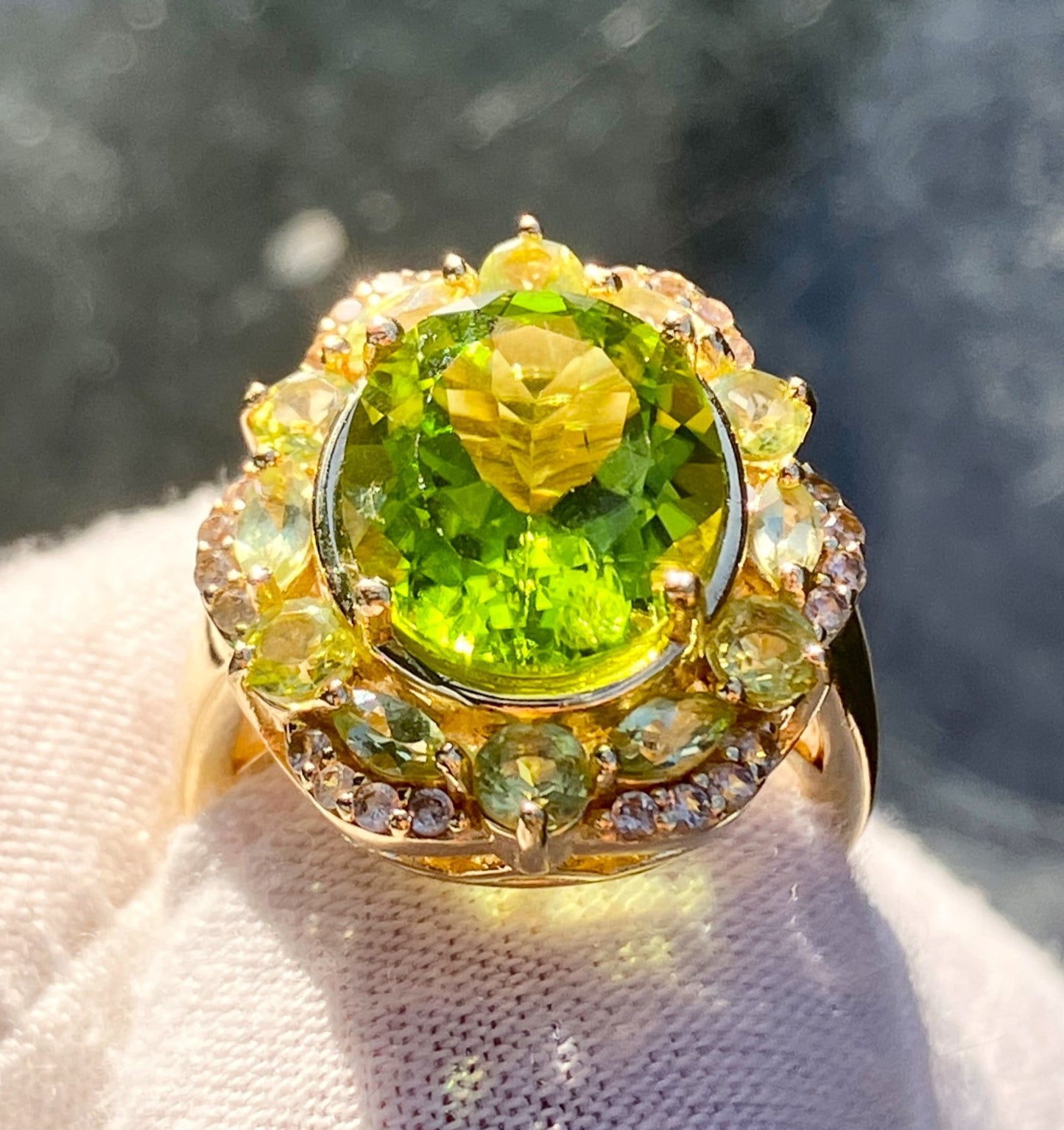 Gold Plated Oval Peridot in a Marquise and Round Cut Peridot Halo with “Diamond” Accents Ring