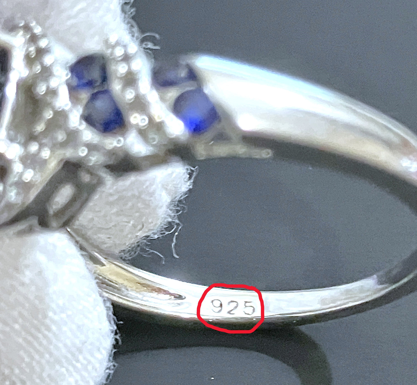 Oval Synthetic Sapphire Wrapped in Bands of Synthetic Sapphire and Colorless Sapphire Ring