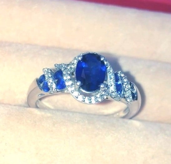 Oval Synthetic Sapphire Wrapped in Bands of Synthetic Sapphire and Colorless Sapphire Ring