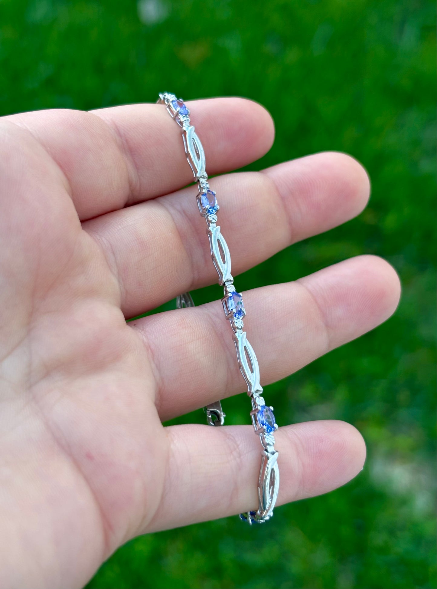 10K White Gold Oval Cut Tanzanite Tennis Bracelet with Diamond Accent
