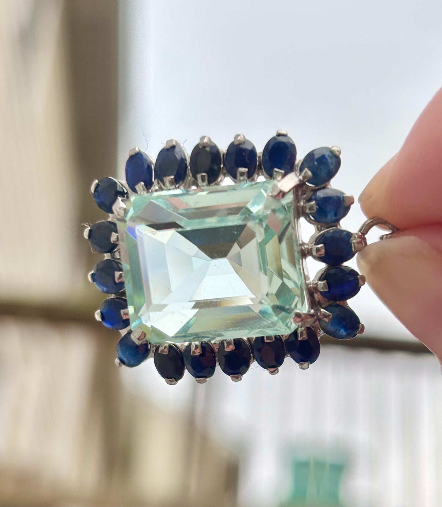 Emerald Cut “Aquamarine” CZ in a Natural Sapphire Halo Pendant