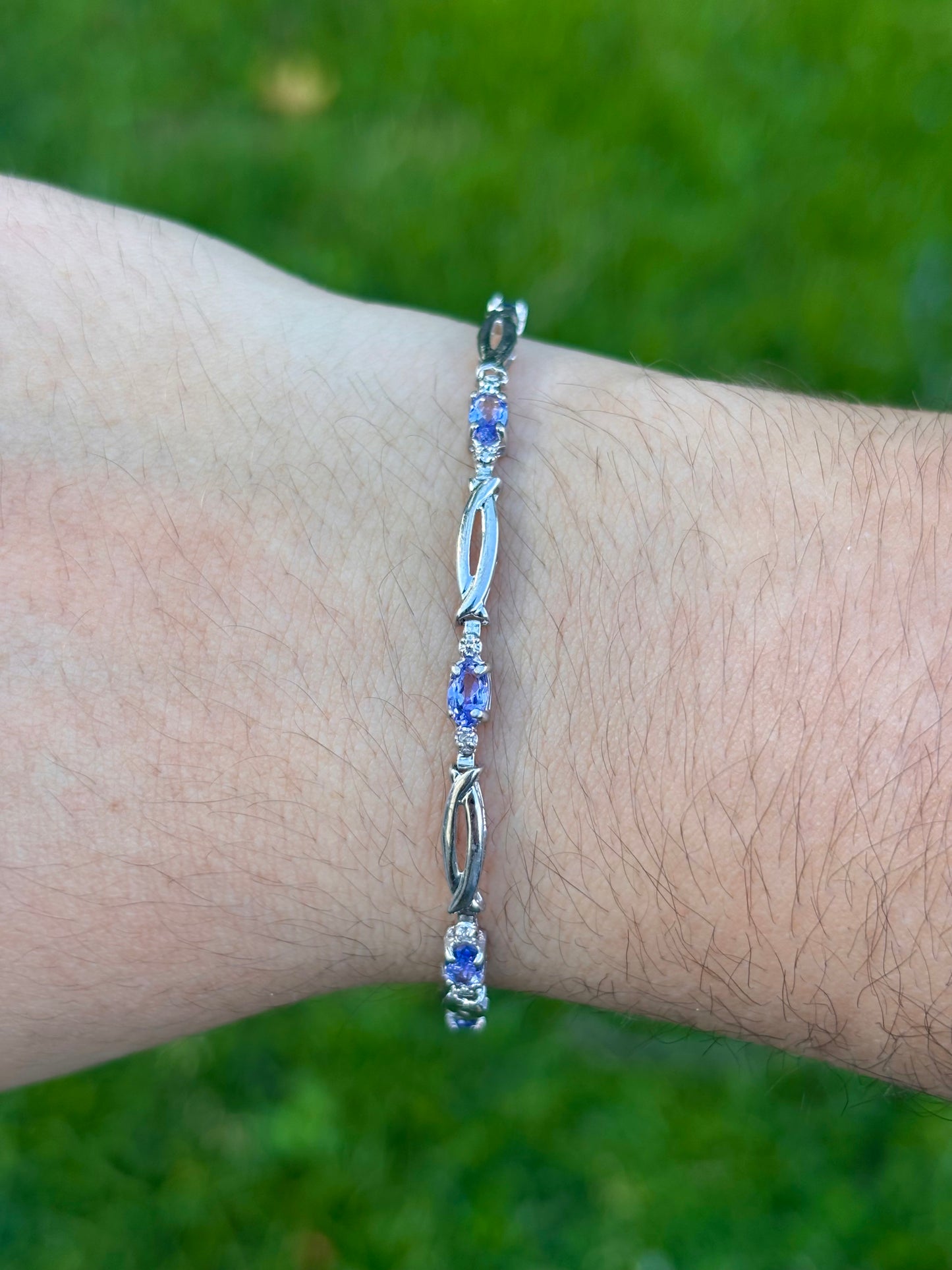 10K White Gold Oval Cut Tanzanite Tennis Bracelet with Diamond Accent