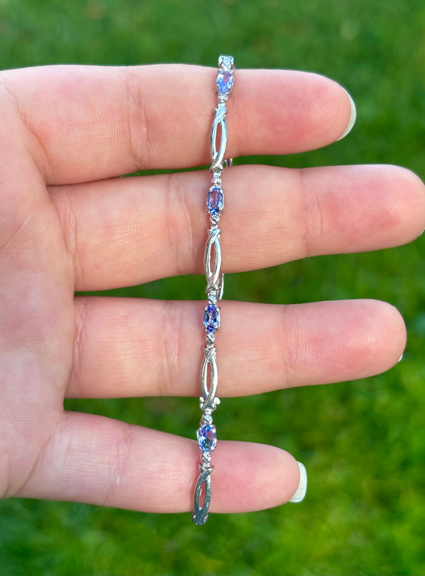 10K White Gold Oval Cut Tanzanite Tennis Bracelet with Diamond Accent