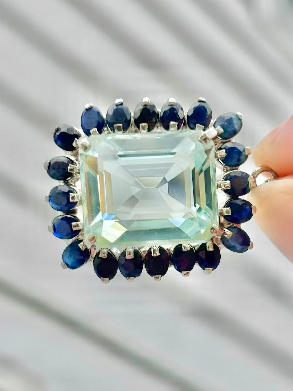 Emerald Cut “Aquamarine” CZ in a Natural Sapphire Halo Pendant