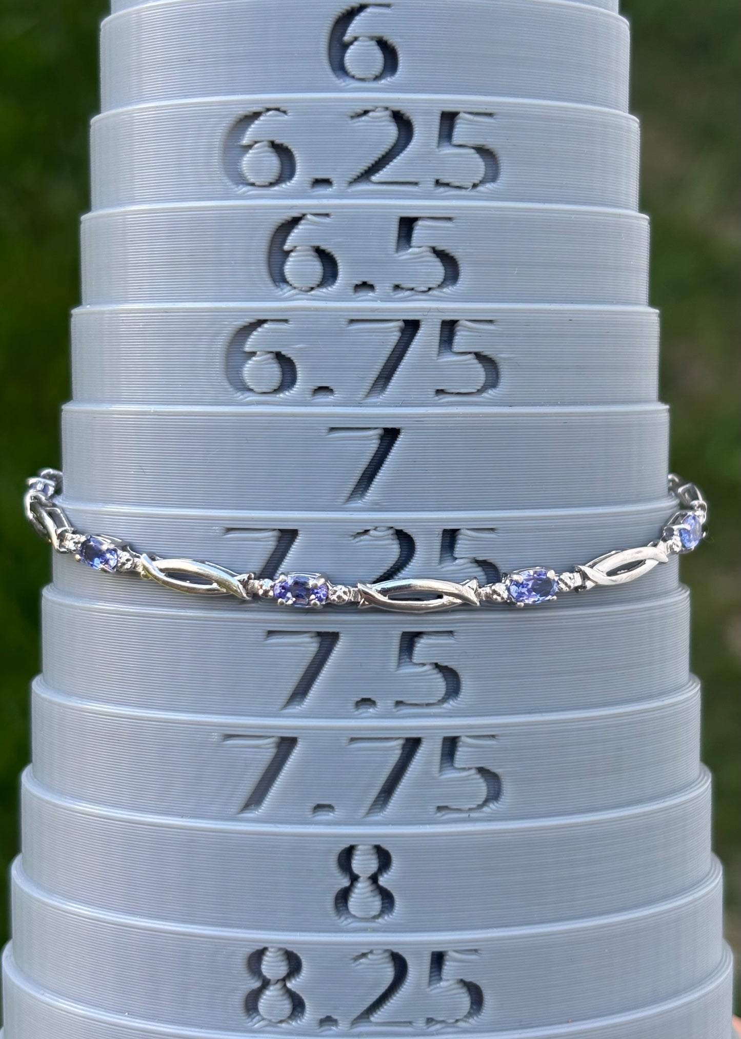 10K White Gold Oval Cut Tanzanite Tennis Bracelet with Diamond Accent