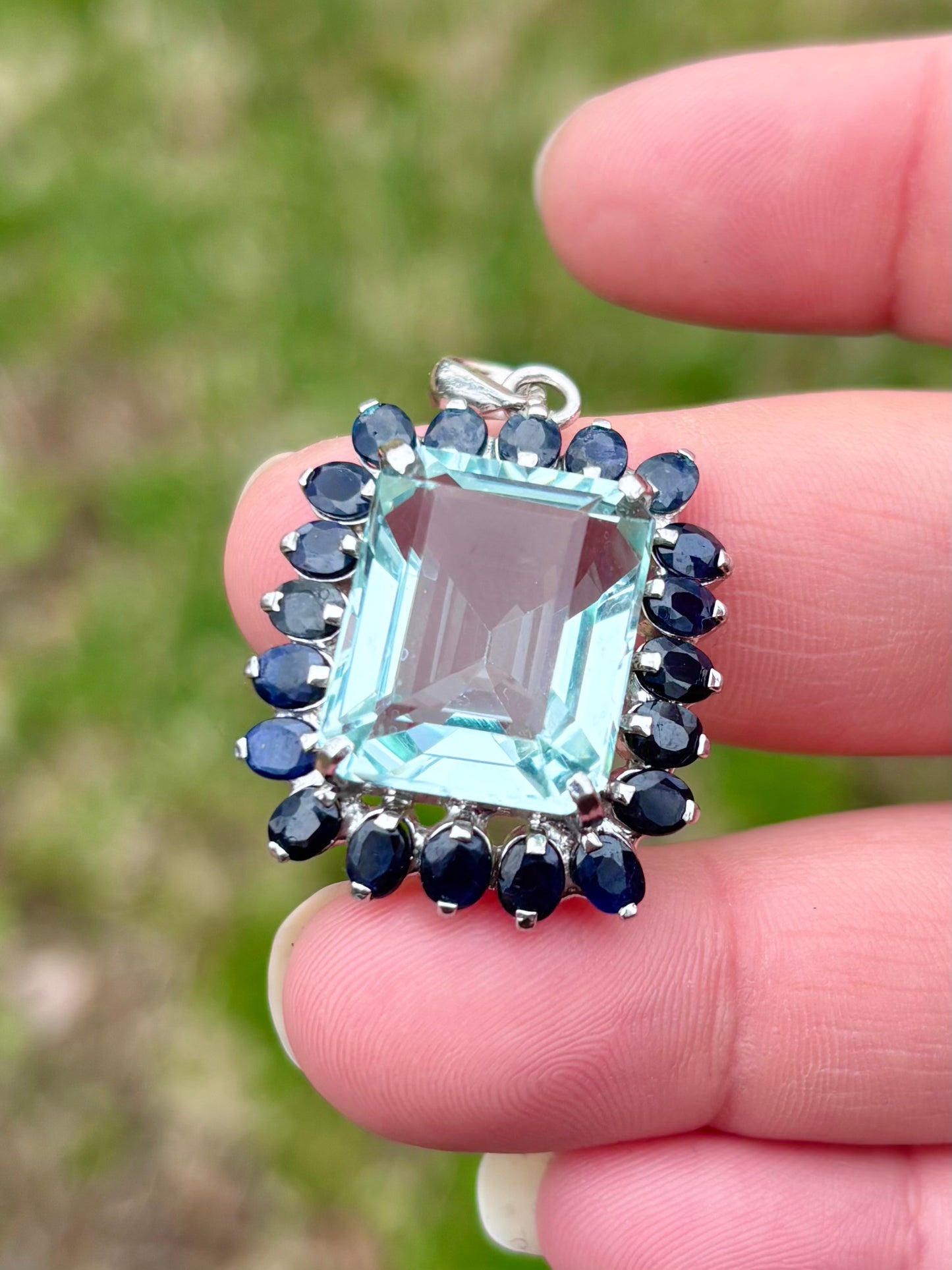 Emerald Cut “Aquamarine” CZ in a Natural Sapphire Halo Pendant