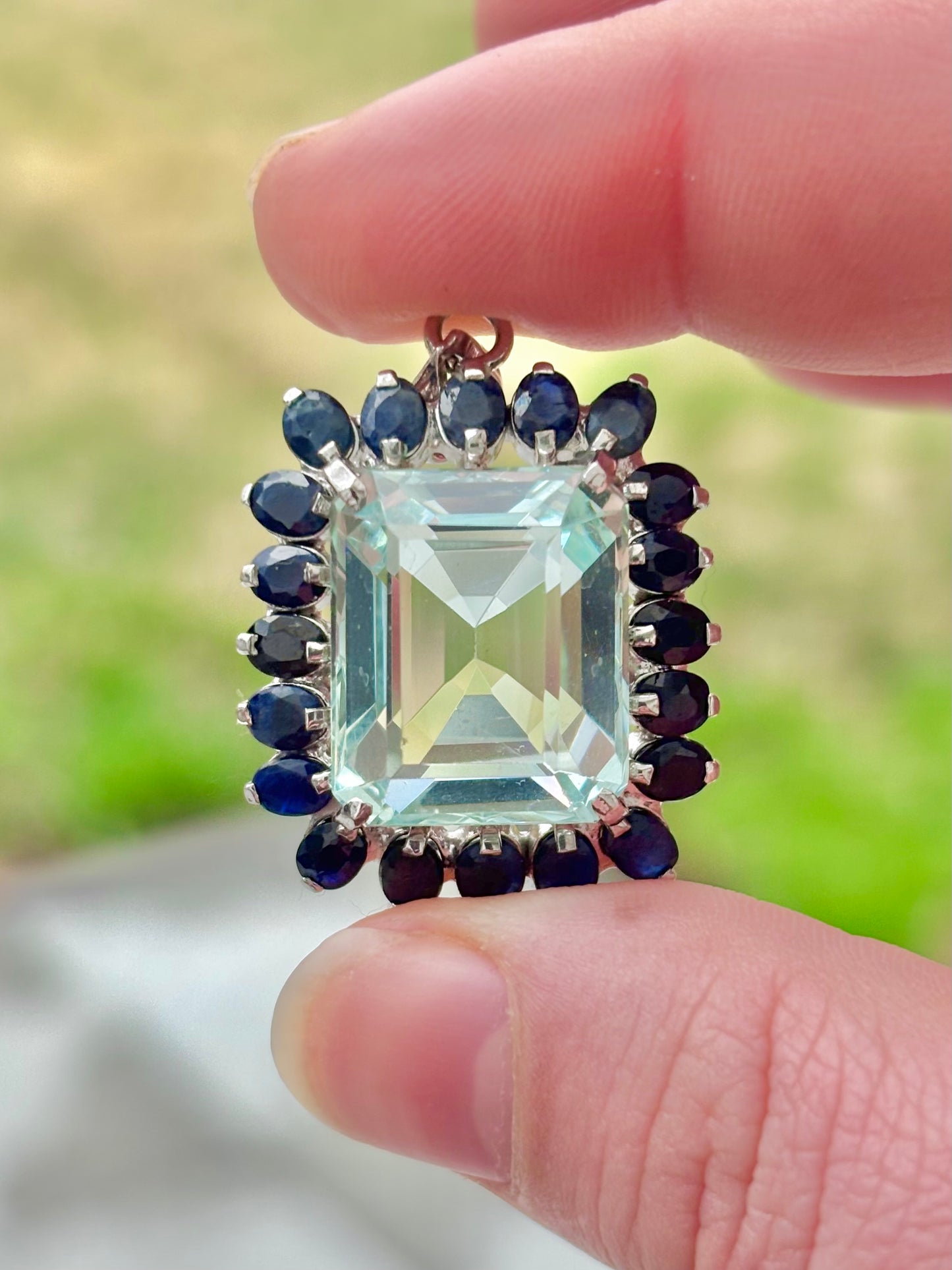 Emerald Cut “Aquamarine” CZ in a Natural Sapphire Halo Pendant