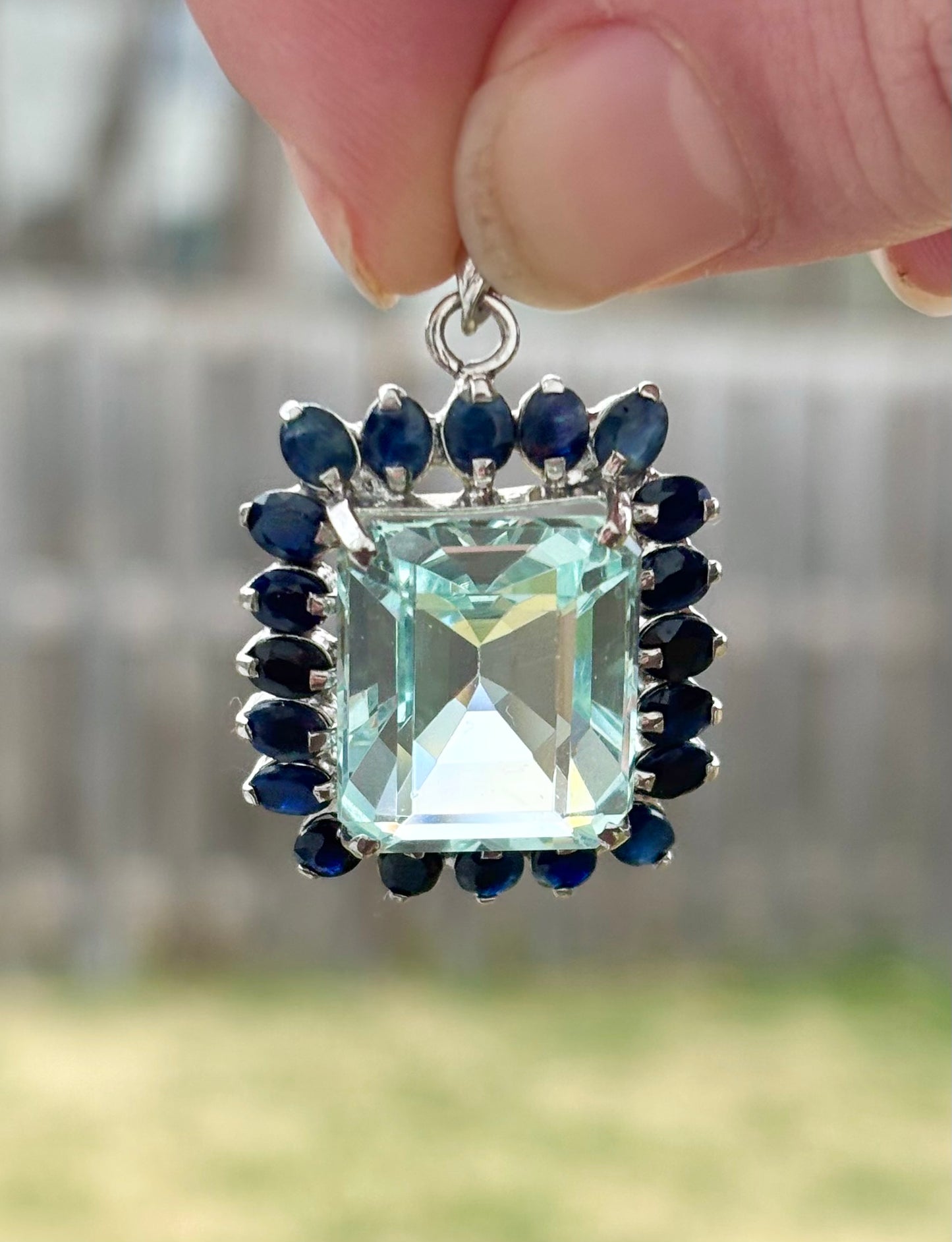 Emerald Cut “Aquamarine” CZ in a Natural Sapphire Halo Pendant