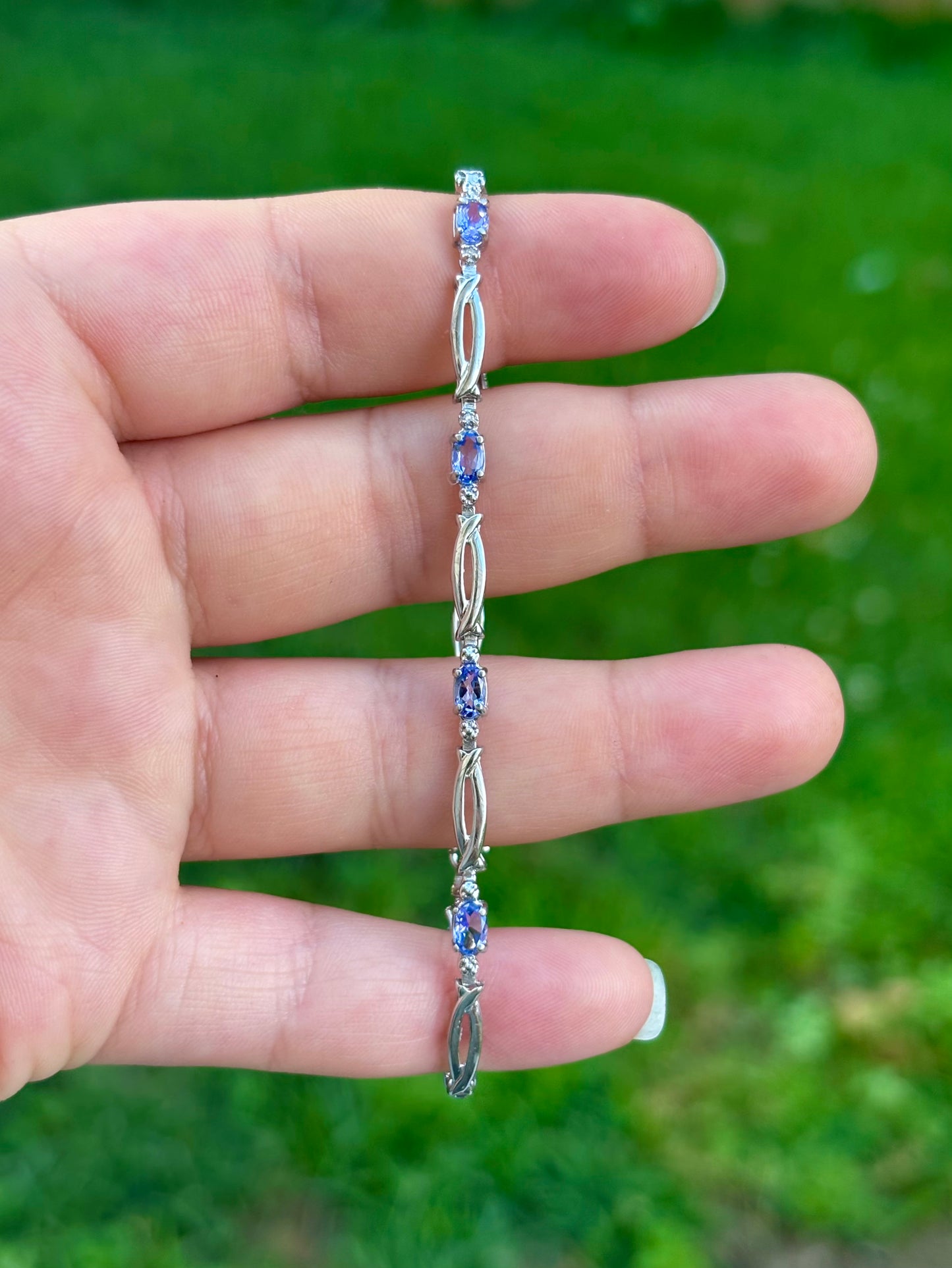 10K White Gold Oval Cut Tanzanite Tennis Bracelet with Diamond Accent