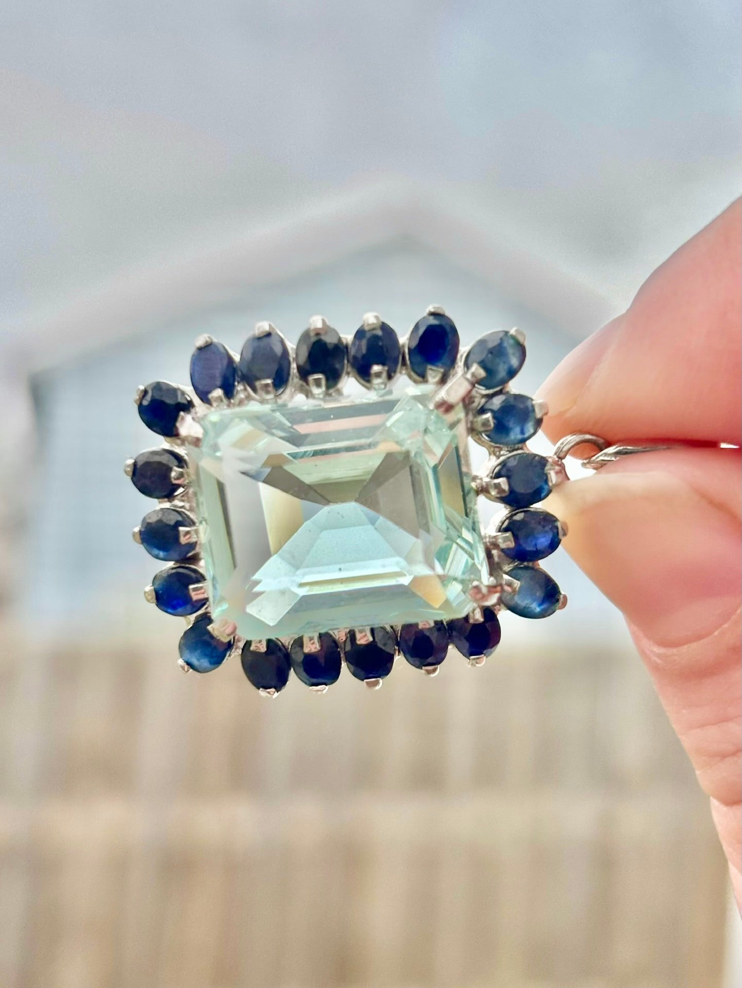 Emerald Cut “Aquamarine” CZ in a Natural Sapphire Halo Pendant