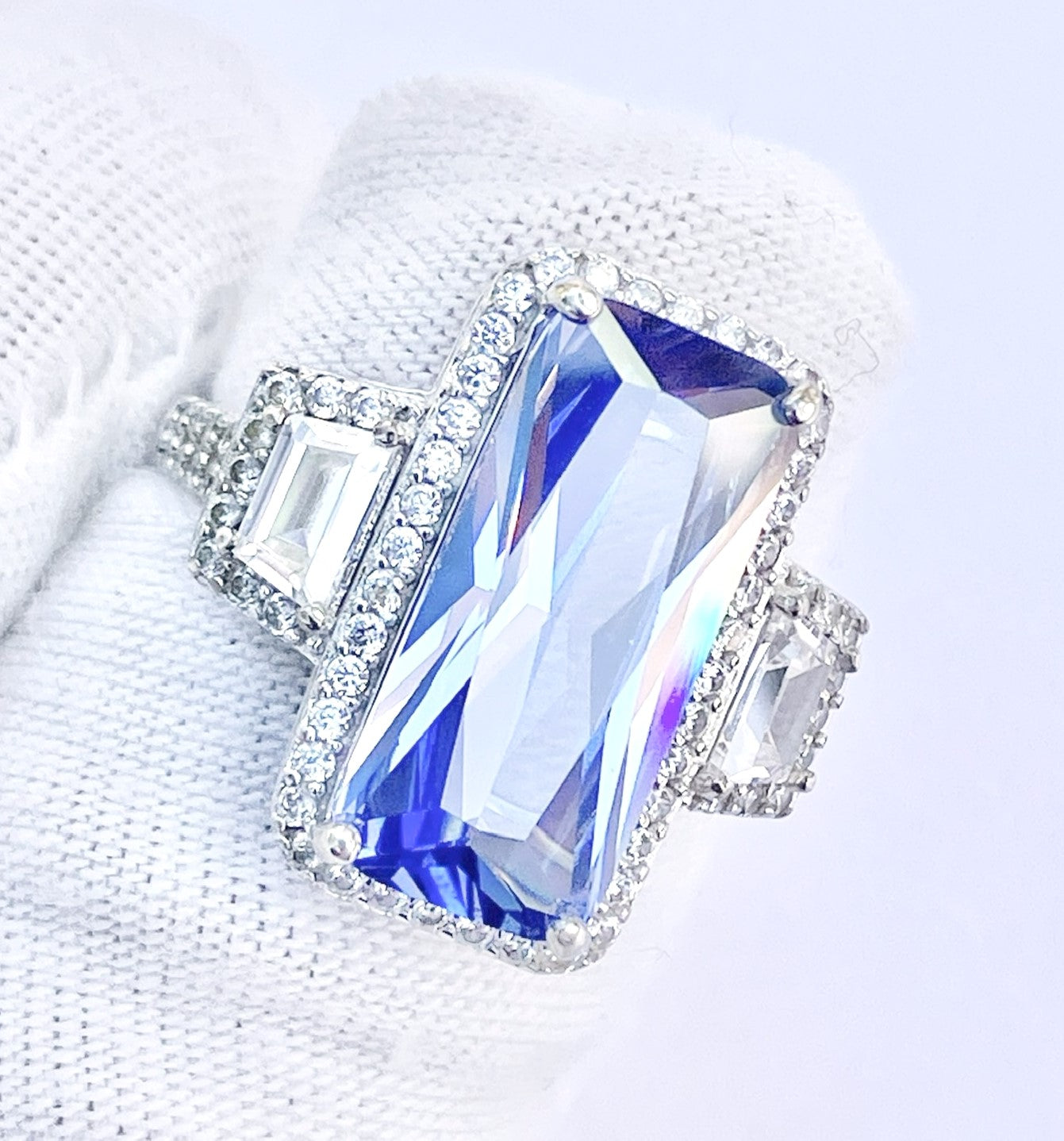 Periwinkle “Sapphire” in “Diamond” Halo with Trapezoid Cut “Diamond” Accents