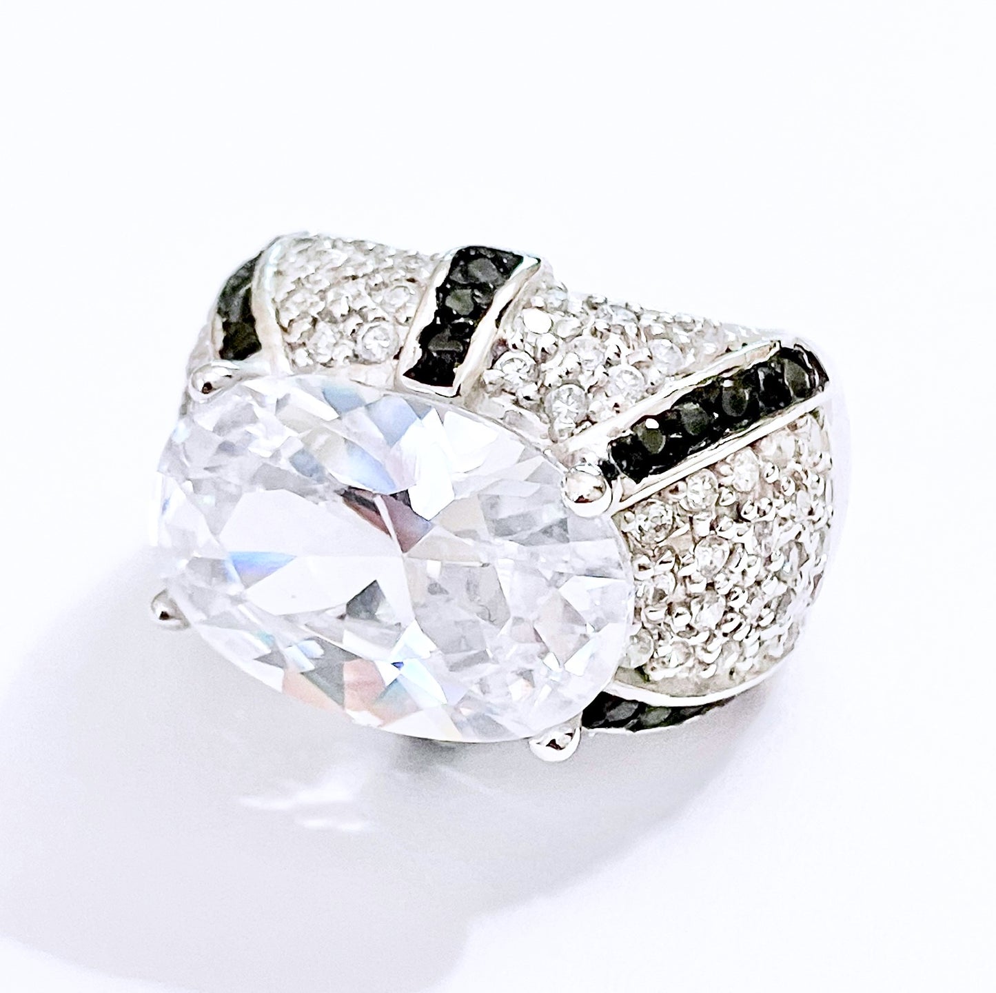 Oval Cut “Diamond” in Black and Colorless “Diamond” Dome Setting Ring