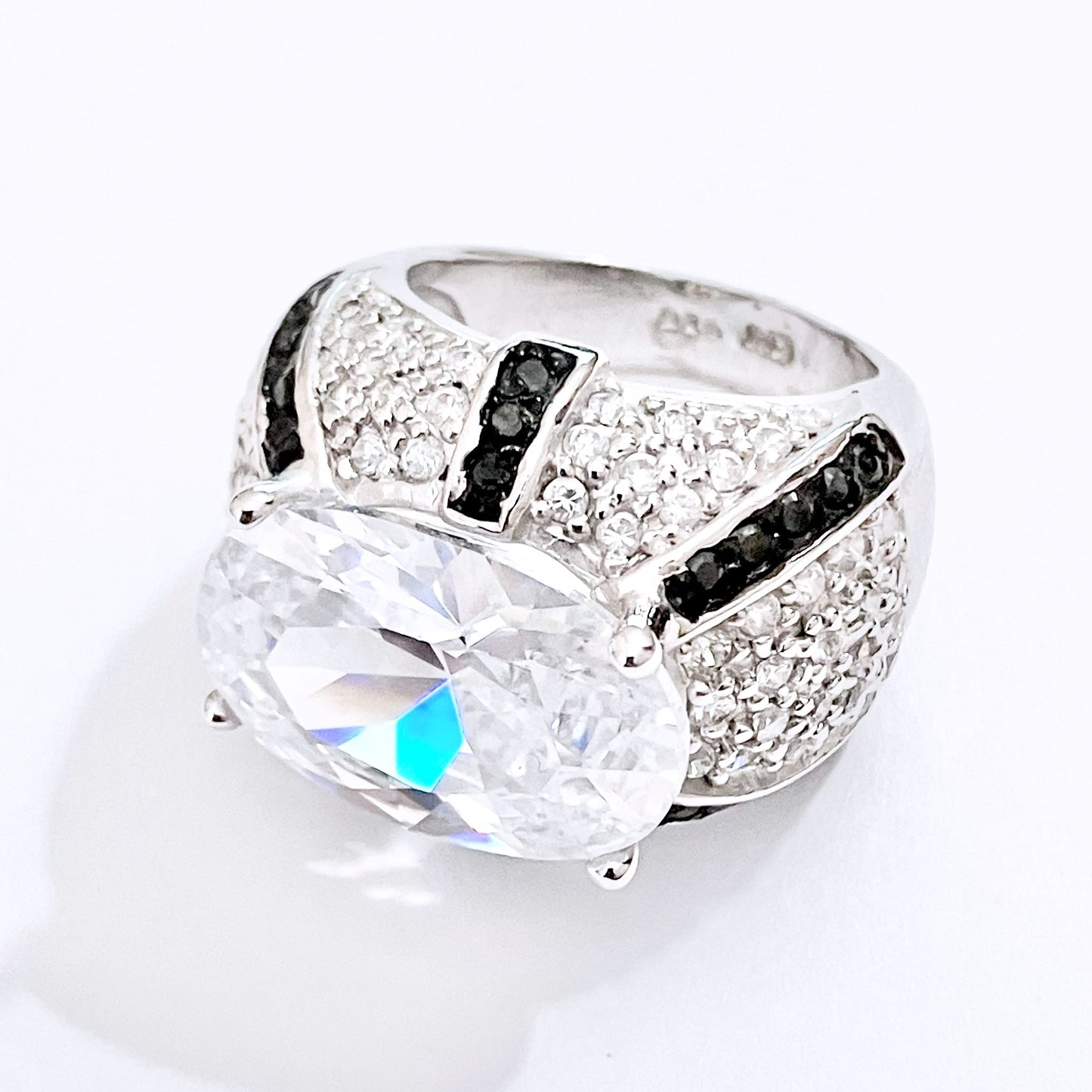 Oval Cut “Diamond” in Black and Colorless “Diamond” Dome Setting Ring