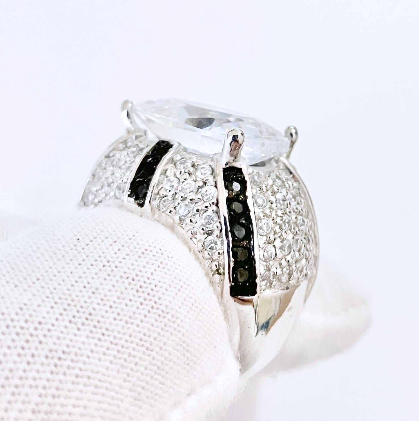 Oval Cut “Diamond” in Black and Colorless “Diamond” Dome Setting Ring