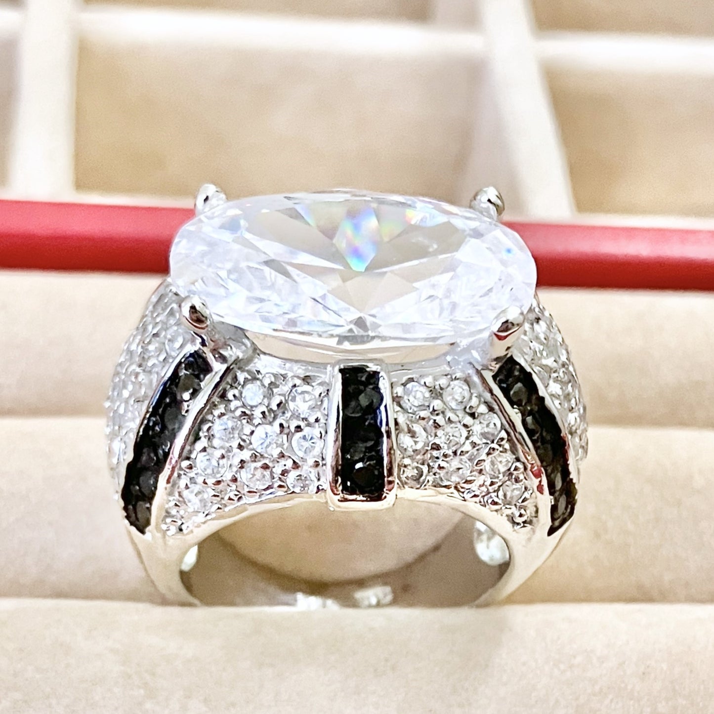 Oval Cut “Diamond” in Black and Colorless “Diamond” Dome Setting Ring