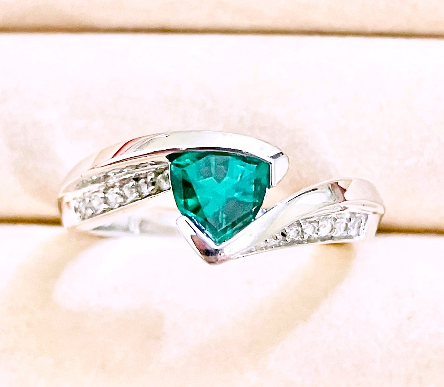 Triangular Brilliant Cut “Emerald” in Curved Bypass Shank with “Diamond” Accents Ring