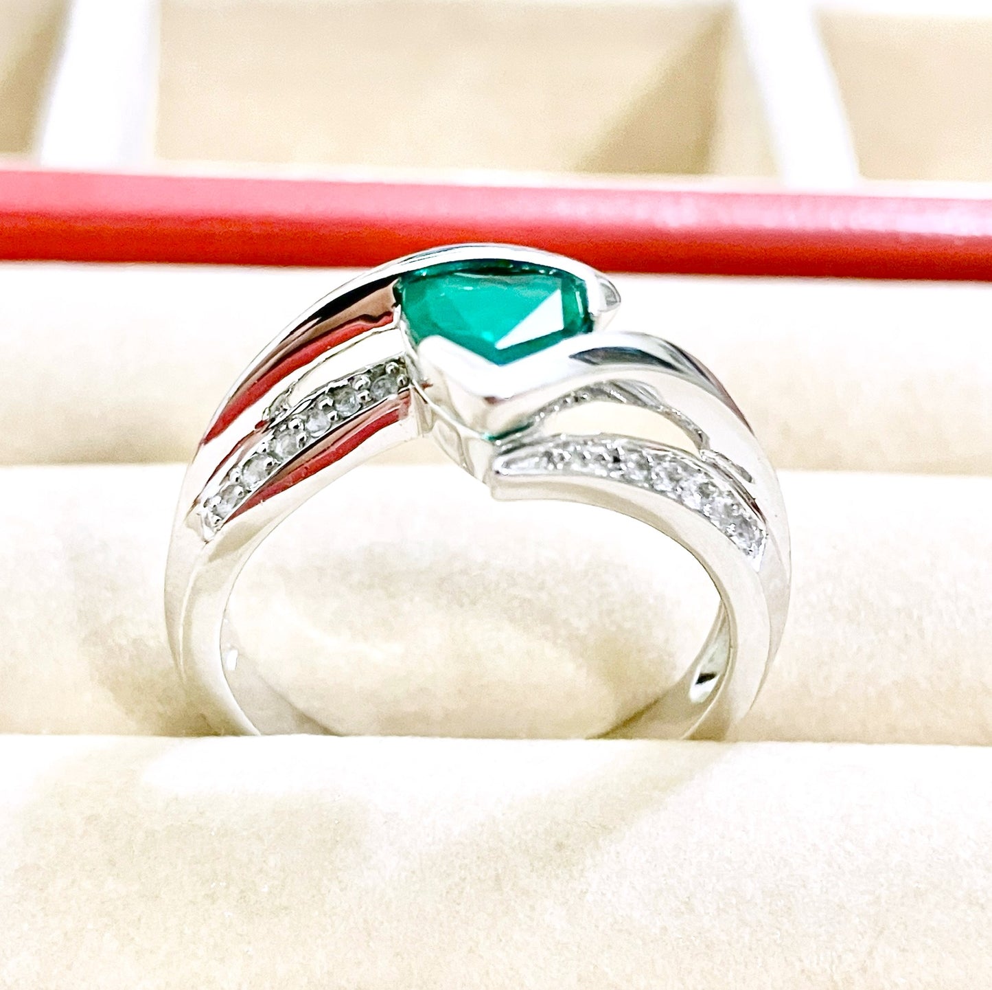 Triangular Brilliant Cut “Emerald” in Curved Bypass Shank with “Diamond” Accents Ring
