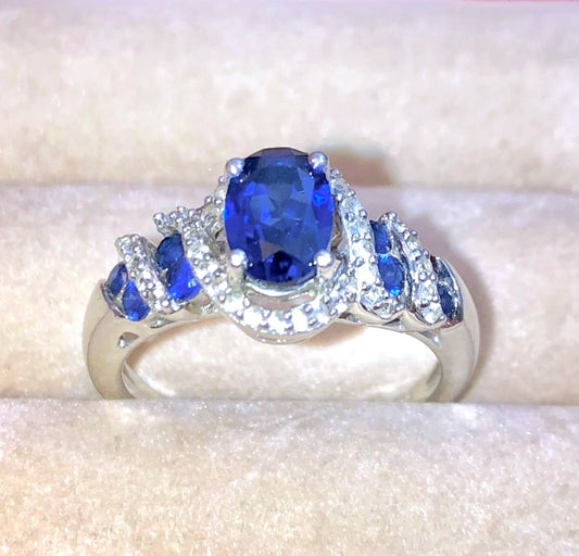 Oval Synthetic Sapphire Wrapped in Bands of Synthetic Sapphire and Colorless Sapphire Ring